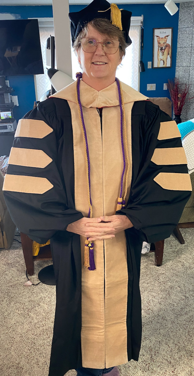 Amanda Tanner in her graduation attire ready to receive her Doctorate Degree
